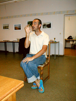 Augusto drinking a cuppa according to etiquette